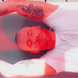 Man sleeping in front of red light therapy - Vital Red Light