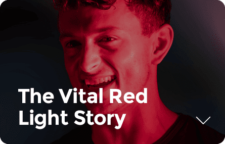 A person smiling, illuminated by red light, with the text "The Vital Red Light Story" overlaid, sparking curiosity about what red light therapy is good for.