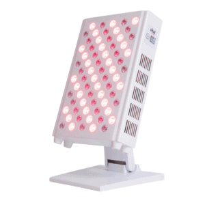 A white LED light therapy panel with multiple circular light bulbs, set on a stand, illuminated and slightly tilted—ideal for red light therapy devices for home use or even a chic addition to any professional shop.